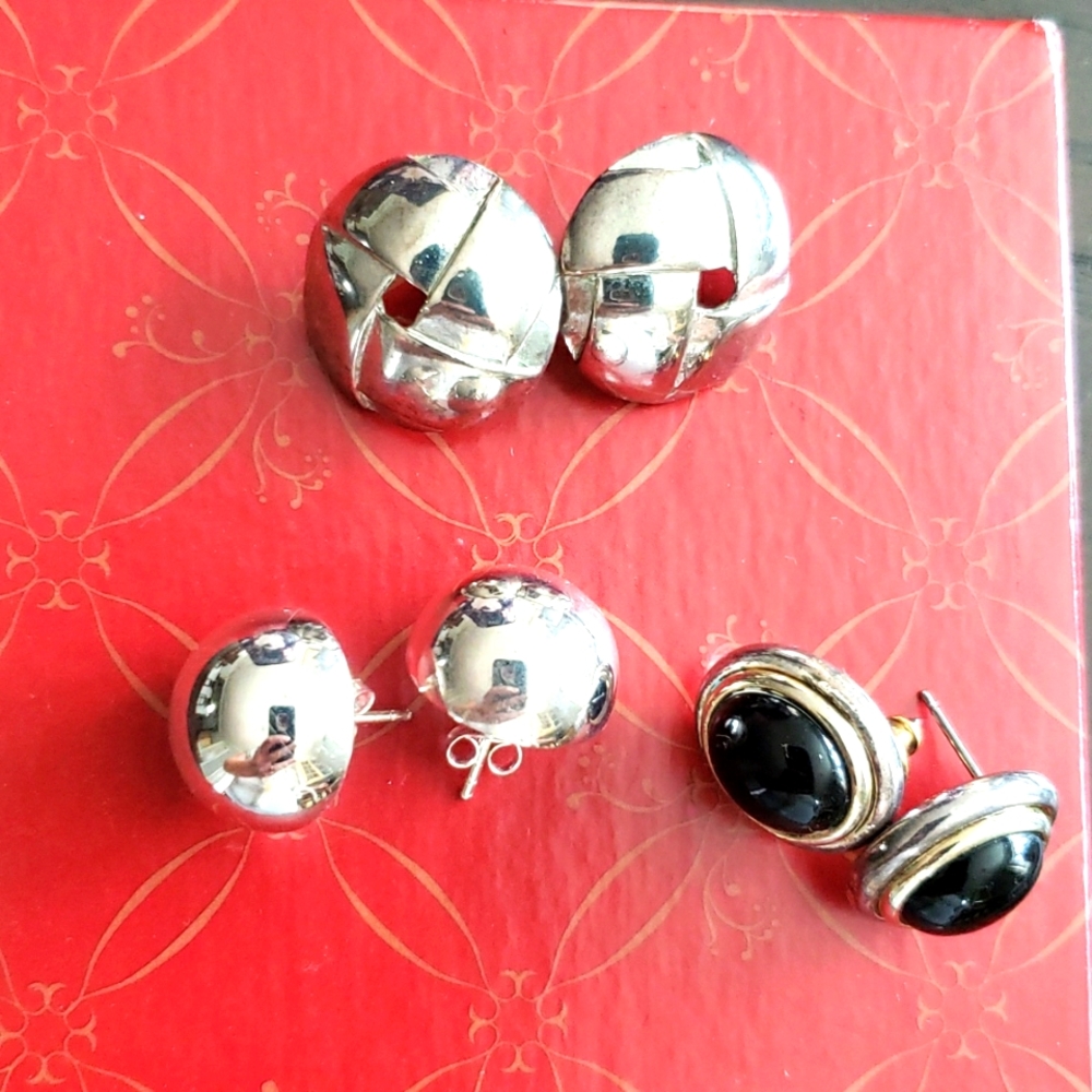 Set of three silver stud earrings